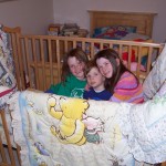 Three kids...three Winnie the Pooh crib comforters...the day we dismantled the crib for the last time!