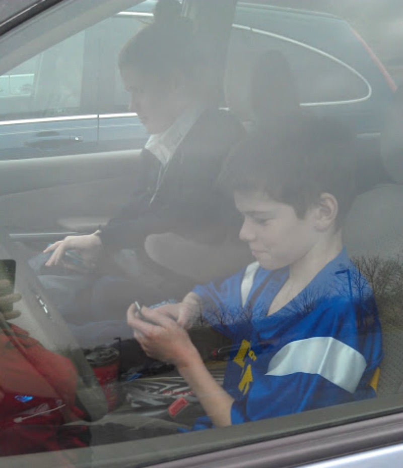 James in Front Seat of Minivan